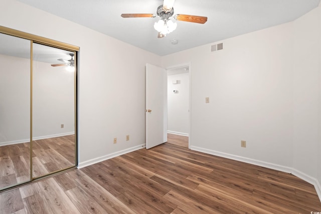 2122 Clearwater Dr Unit C, Surfside Beach, SC 29575 - unfurnished bedroom with wood finished floors, a closet, and ceiling fan