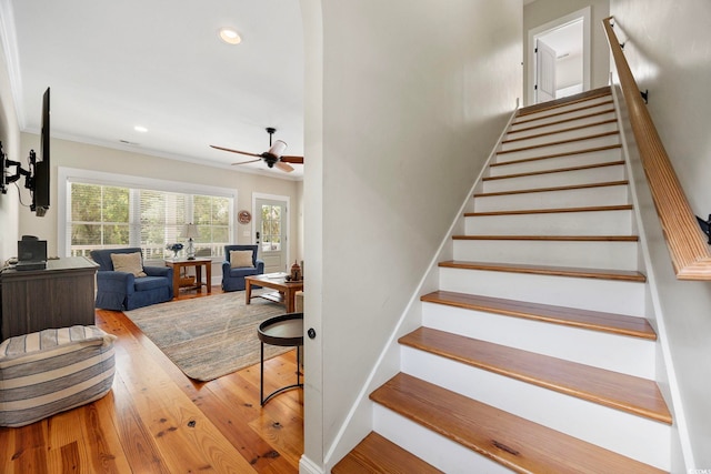 43 Sandlapper Way, Pawleys Island, SC 29585 - stairway featuring a ceiling fan, wood finished floors, recessed lighting, and crown molding