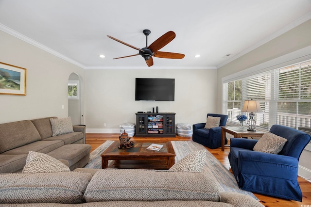 43 Sandlapper Way, Pawleys Island, SC 29585 - living room featuring arched walkways, light wood-type flooring, ceiling fan, recessed lighting, and crown molding