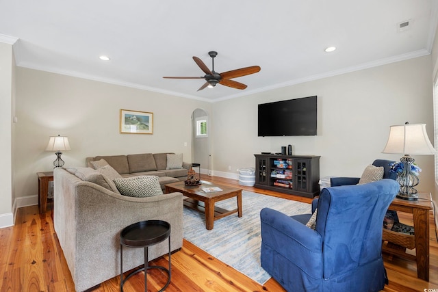 43 Sandlapper Way, Pawleys Island, SC 29585 - living area featuring ceiling fan, arched walkways, light wood-style flooring, ornamental molding, and recessed lighting