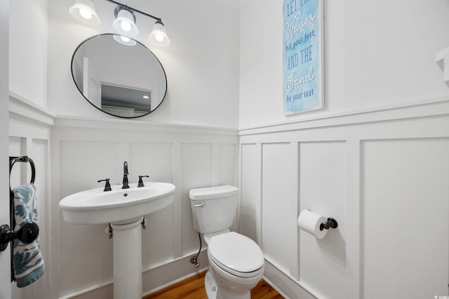 43 Sandlapper Way, Pawleys Island, SC 29585 - bathroom with a decorative wall, wainscoting, and wood finished floors