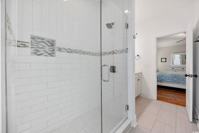 43 Sandlapper Way, Pawleys Island, SC 29585 - ensuite bathroom with a stall shower, vanity, a ceiling fan, and crown molding