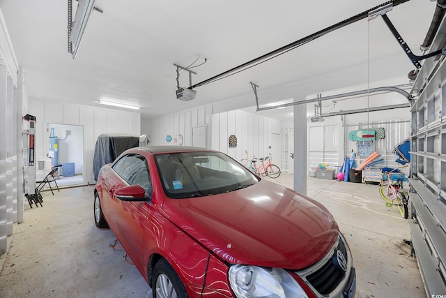 43 Sandlapper Way, Pawleys Island, SC 29585 - garage featuring a garage door opener and secured water heater
