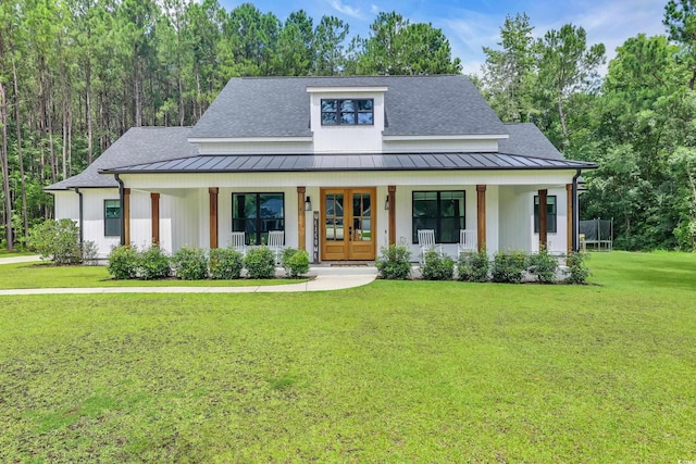 141 Evans Branch Ct, Galivants Ferry, SC 29544 - modern inspired farmhouse with a standing seam roof, a porch, a front yard, and a metal roof