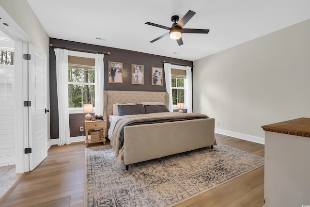 141 Evans Branch Ct, Galivants Ferry, SC 29544 - bedroom featuring wood finished floors, a ceiling fan, and an accent wall