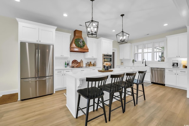 141 Evans Branch Ct, Galivants Ferry, SC 29544 - kitchen with appliances with stainless steel finishes, custom exhaust hood, tasteful backsplash, light countertops, and recessed lighting