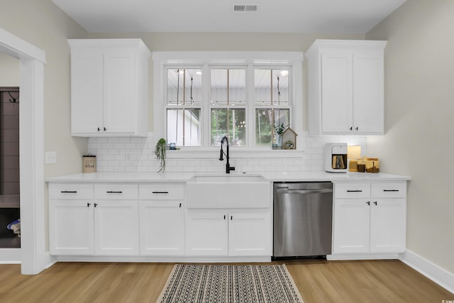 141 Evans Branch Ct, Galivants Ferry, SC 29544 - kitchen featuring dishwasher, light wood-style floors, decorative backsplash, and light countertops