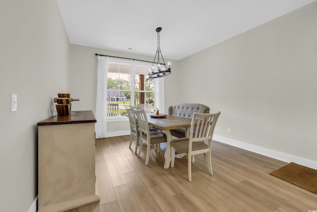 141 Evans Branch Ct, Galivants Ferry, SC 29544 - dining area with a chandelier and light wood-style flooring
