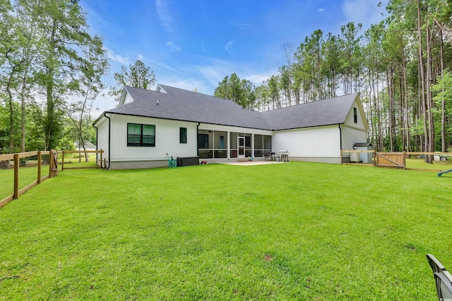 141 Evans Branch Ct, Galivants Ferry, SC 29544 - back of house featuring a sunroom, a shingled roof, a gate, and a patio area