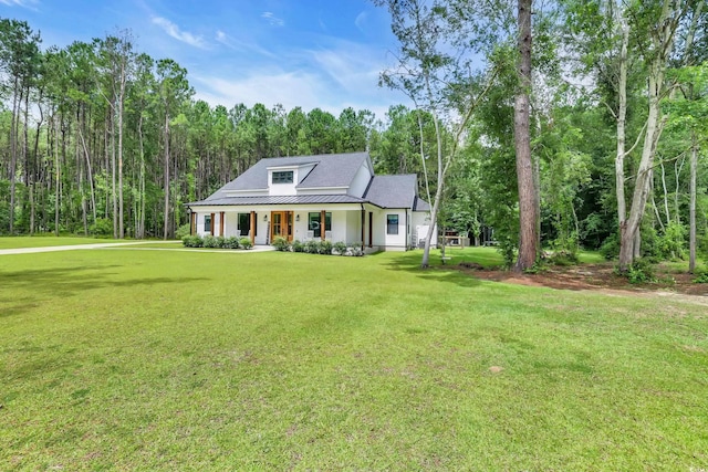 141 Evans Branch Ct, Galivants Ferry, SC 29544 - view of front of property with covered porch, a front yard, a standing seam roof, and a metal roof