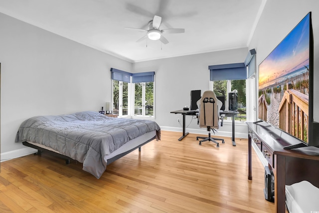 231 Live Oak Ln, Myrtle Beach, SC 29572 - bedroom with crown molding, a desk, light wood-type flooring, and ceiling fan