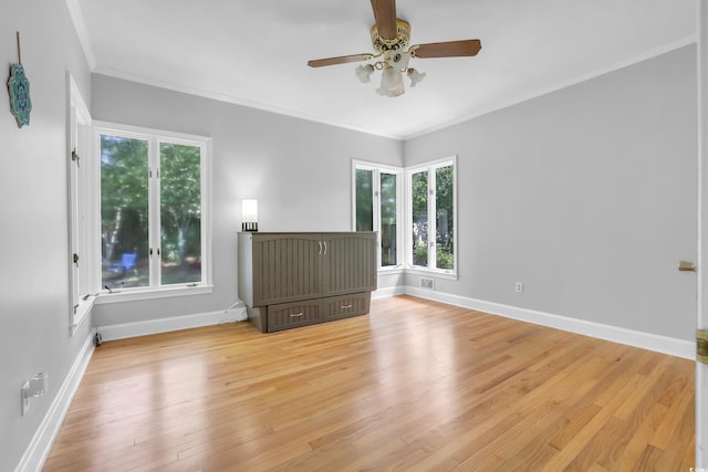 231 Live Oak Ln, Myrtle Beach, SC 29572 - unfurnished living room featuring a ceiling fan, light wood-style flooring, and ornamental molding