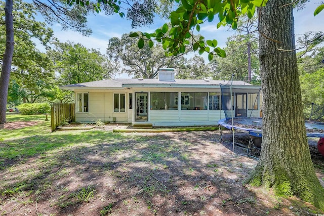 231 Live Oak Ln, Myrtle Beach, SC 29572 - rear view of property featuring a trampoline and a sunroom