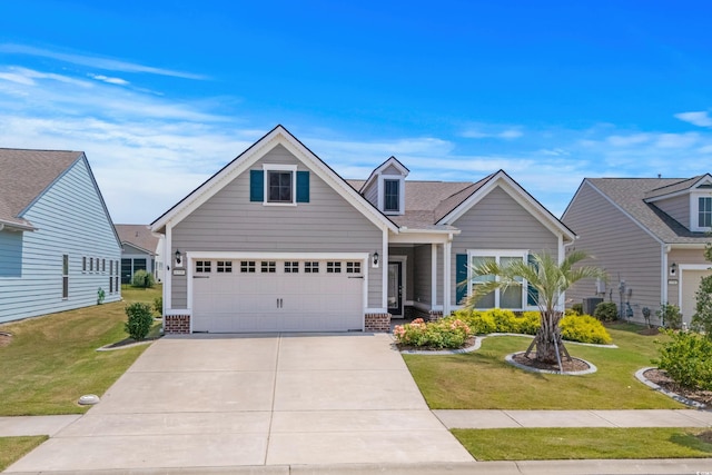 6550 Anterselva Dr, Myrtle Beach, SC 29572 - traditional home with concrete driveway, a front lawn, an attached garage, and brick siding