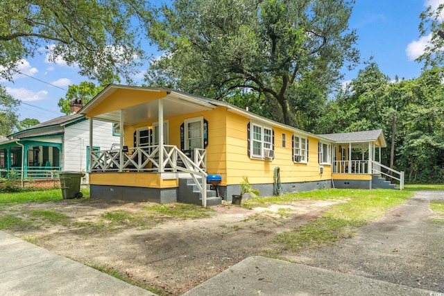 414 King St, Georgetown, SC 29440 - view of front of house with covered porch and crawl space