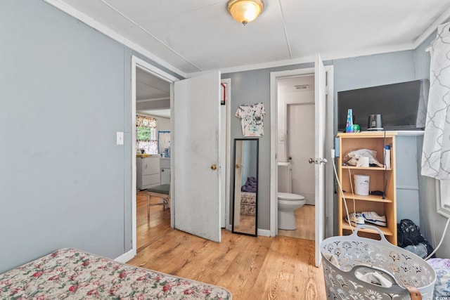 414 King St, Georgetown, SC 29440 - bedroom featuring wood finished floors and connected bathroom