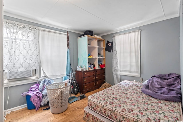 414 King St, Georgetown, SC 29440 - bedroom with wood finished floors, ornamental molding, and multiple windows