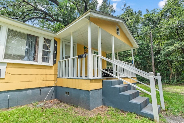 414 King St, Georgetown, SC 29440 - view of home's exterior with crawl space and a porch