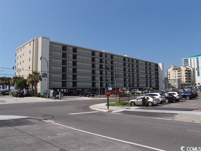 2101 S Ocean Blvd, North Myrtle Beach, SC 29582 - view of apartment building / complex featuring uncovered parking
