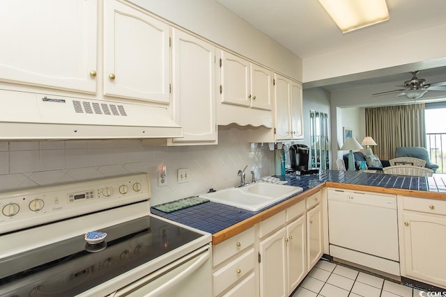 2101 S Ocean Blvd, North Myrtle Beach, SC 29582 - kitchen featuring white appliances, backsplash, ventilation hood, and open floor plan