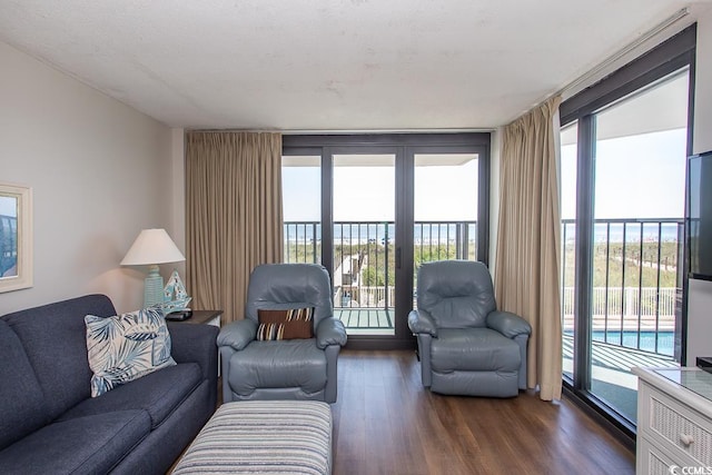 2101 S Ocean Blvd, North Myrtle Beach, SC 29582 - living room with dark wood finished floors and plenty of natural light