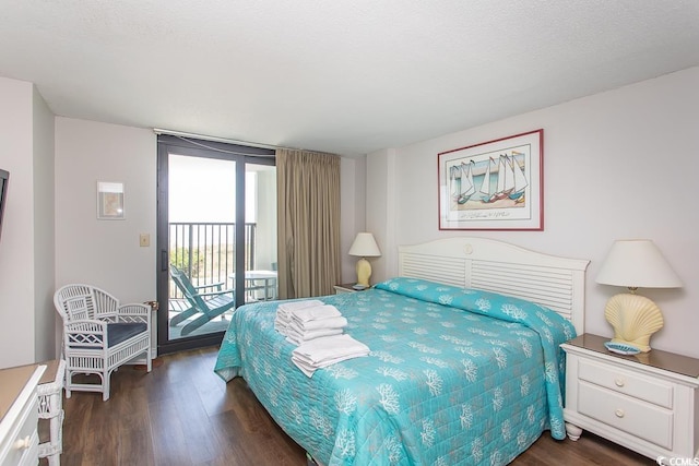 2101 S Ocean Blvd, North Myrtle Beach, SC 29582 - bedroom with access to exterior and dark wood-style flooring