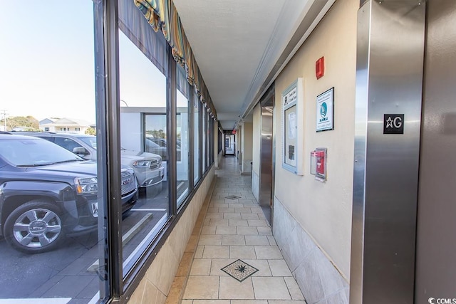 2101 S Ocean Blvd, North Myrtle Beach, SC 29582 - hallway with elevator and light tile patterned floors