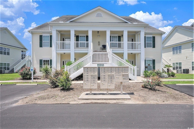 4925 Pond Shoals Ct Unit 202, Myrtle Beach, SC 29579 - neoclassical home with stairway and covered porch