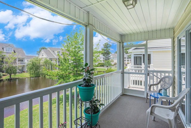 4925 Pond Shoals Ct Unit 202, Myrtle Beach, SC 29579 - unfurnished sunroom with a residential view, plenty of natural light, and a water view