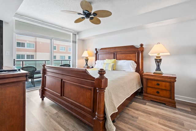 2001 S Ocean Blvd Unit 901, North Myrtle Beach, SC 29582 - bedroom with light wood-style floors, a textured ceiling, access to outside, and ceiling fan