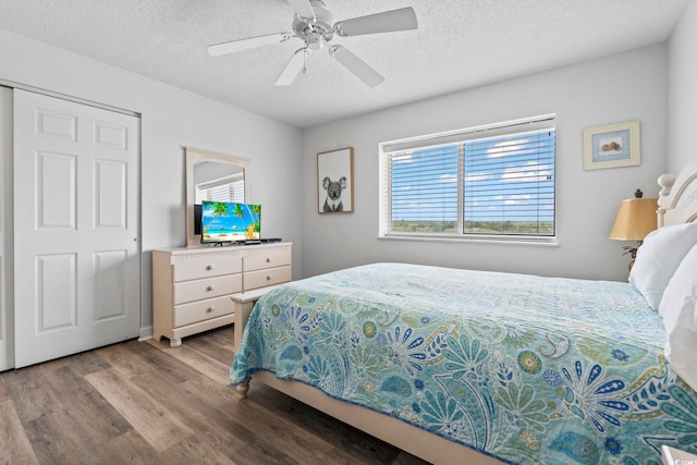2001 S Ocean Blvd Unit 901, North Myrtle Beach, SC 29582 - bedroom with wood finished floors, a textured ceiling, and ceiling fan