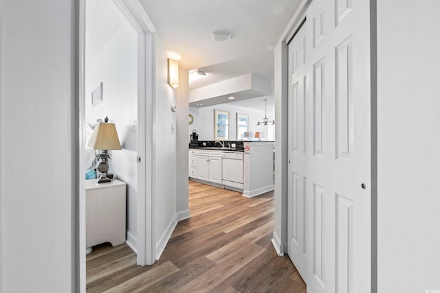 2001 S Ocean Blvd Unit 901, North Myrtle Beach, SC 29582 - hallway featuring light wood finished floors and a sink