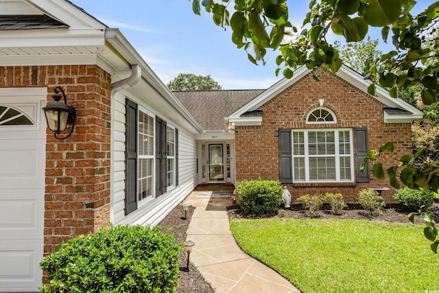 3845 Camden Dr, Myrtle Beach, SC 29588 - entrance to property featuring brick siding, a yard, a garage, and roof with shingles