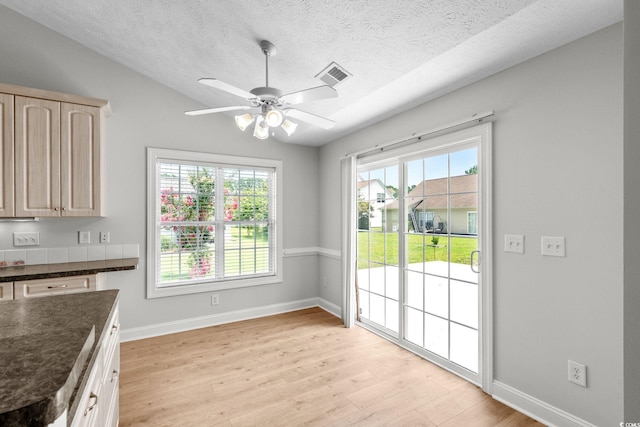 3845 Camden Dr, Myrtle Beach, SC 29588 - unfurnished dining area featuring light wood-style floors, ceiling fan, and a textured ceiling