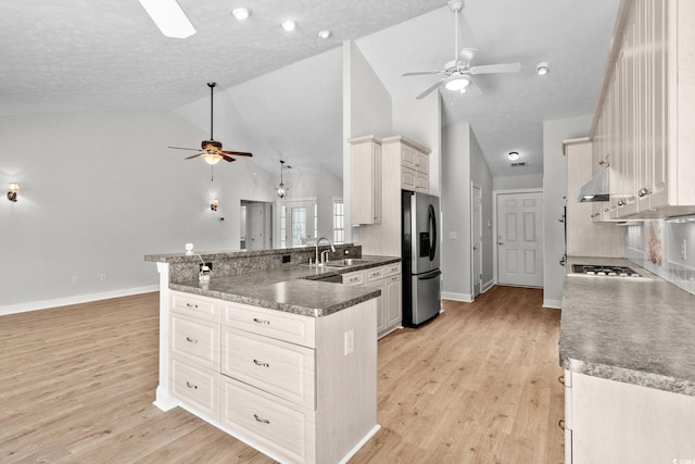 3845 Camden Dr, Myrtle Beach, SC 29588 - kitchen featuring ceiling fan, stainless steel refrigerator with ice dispenser, a peninsula, under cabinet range hood, and light wood-type flooring