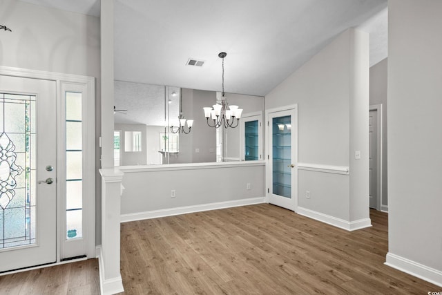 3845 Camden Dr, Myrtle Beach, SC 29588 - foyer with wood finished floors, a chandelier, and lofted ceiling