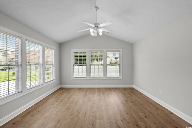 3845 Camden Dr, Myrtle Beach, SC 29588 - empty room featuring wood finished floors, healthy amount of natural light, vaulted ceiling, and ceiling fan