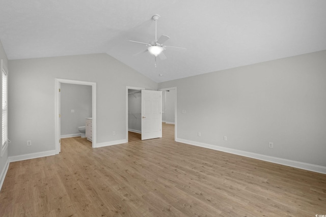 3845 Camden Dr, Myrtle Beach, SC 29588 - unfurnished bedroom featuring light wood-type flooring, lofted ceiling, a spacious closet, connected bathroom, and a closet