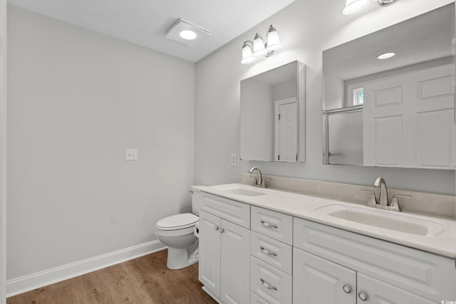 3845 Camden Dr, Myrtle Beach, SC 29588 - full bathroom featuring double vanity and wood finished floors