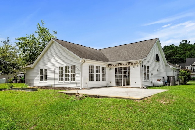 3845 Camden Dr, Myrtle Beach, SC 29588 - rear view of property with a patio area, a yard, and a shingled roof