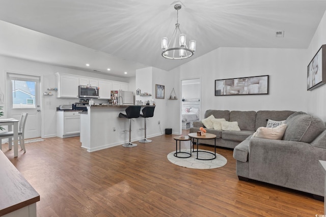 805 Spyderco Rd, Conway, SC 29527 - living area with a chandelier, wood finished floors, vaulted ceiling, and recessed lighting