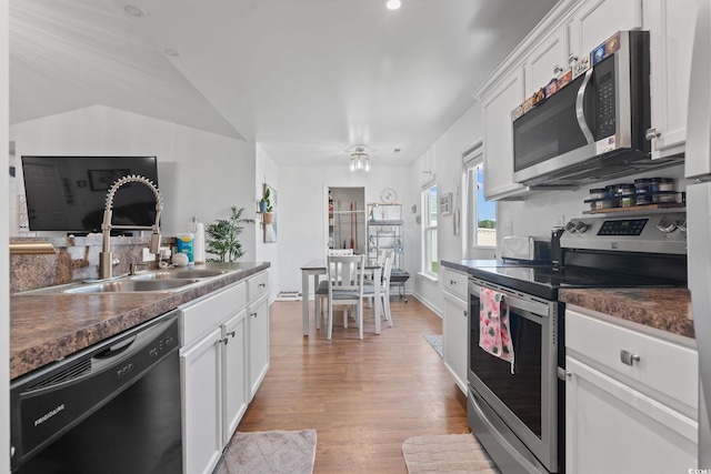 805 Spyderco Rd, Conway, SC 29527 - kitchen with appliances with stainless steel finishes, dark countertops, and white cabinetry