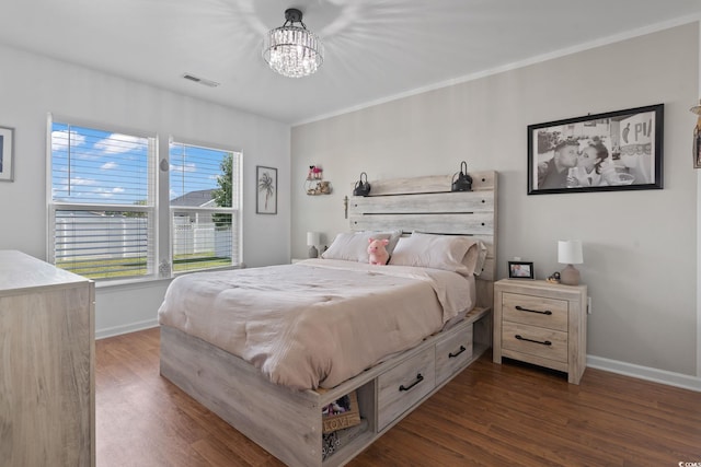 805 Spyderco Rd, Conway, SC 29527 - bedroom featuring dark wood finished floors and a chandelier