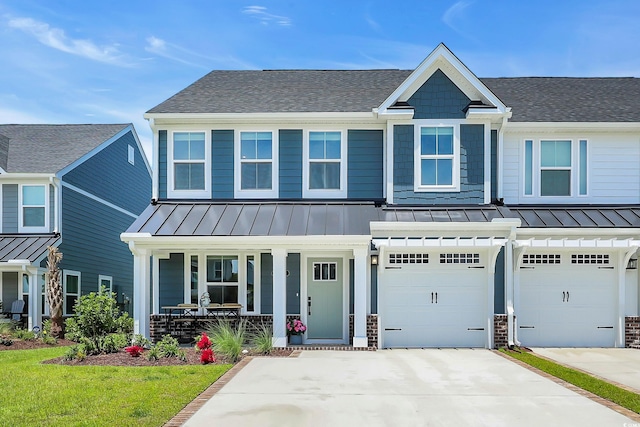 8906 Freya Way Unit 24A, Longs, SC 29568 - craftsman-style house with a standing seam roof, covered porch, a shingled roof, and driveway