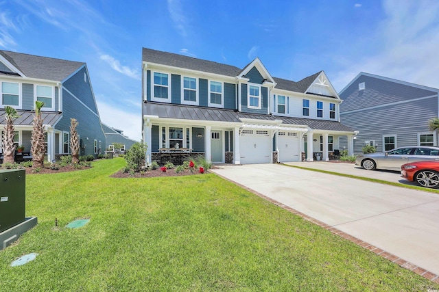 8906 Freya Way Unit 24A, Longs, SC 29568 - view of front facade with a garage, concrete driveway, a standing seam roof, covered porch, and a front yard