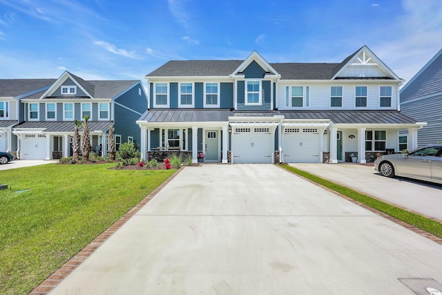 8906 Freya Way Unit 24A, Longs, SC 29568 - view of front facade featuring a standing seam roof, driveway, an attached garage, a porch, and a front lawn