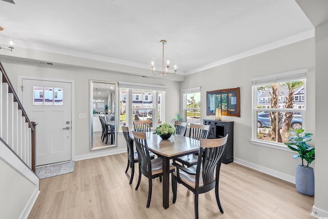 8906 Freya Way Unit 24A, Longs, SC 29568 - dining room featuring a chandelier, light wood-style flooring, stairs, plenty of natural light, and ornamental molding