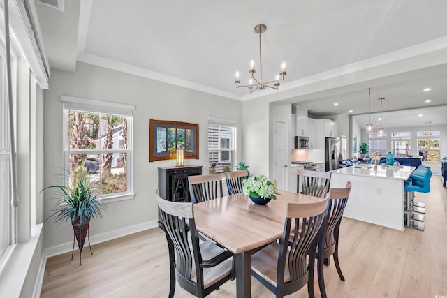 8906 Freya Way Unit 24A, Longs, SC 29568 - dining room featuring healthy amount of natural light, light wood-type flooring, a chandelier, recessed lighting, and crown molding