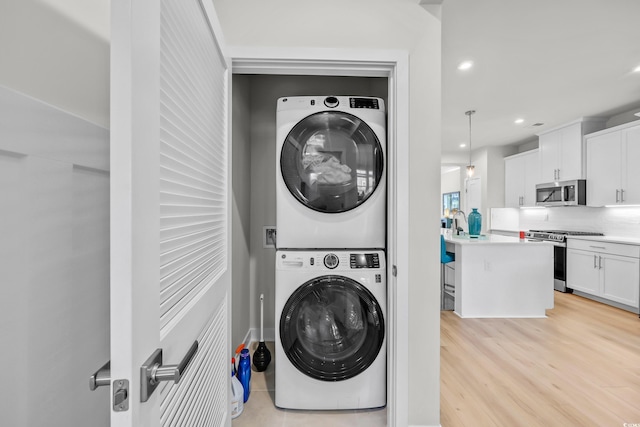 8906 Freya Way Unit 24A, Longs, SC 29568 - washroom featuring estacked washer and dryer, recessed lighting, and light wood finished floors