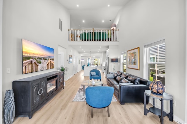 8906 Freya Way Unit 24A, Longs, SC 29568 - living room with a towering ceiling, light wood finished floors, and recessed lighting